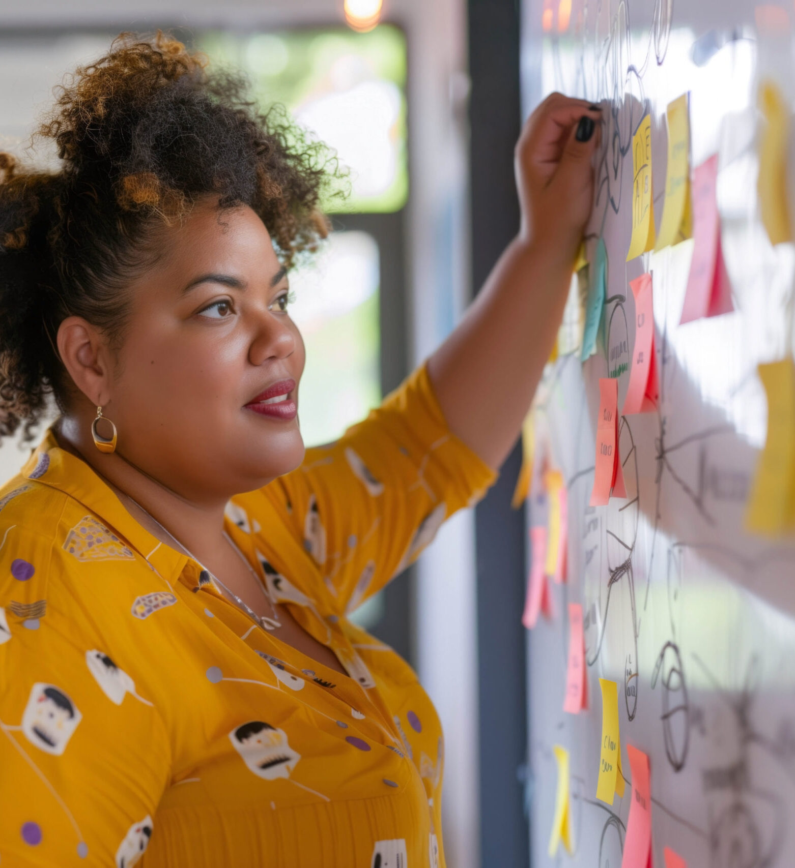 Person organizing colorful sticky notes.