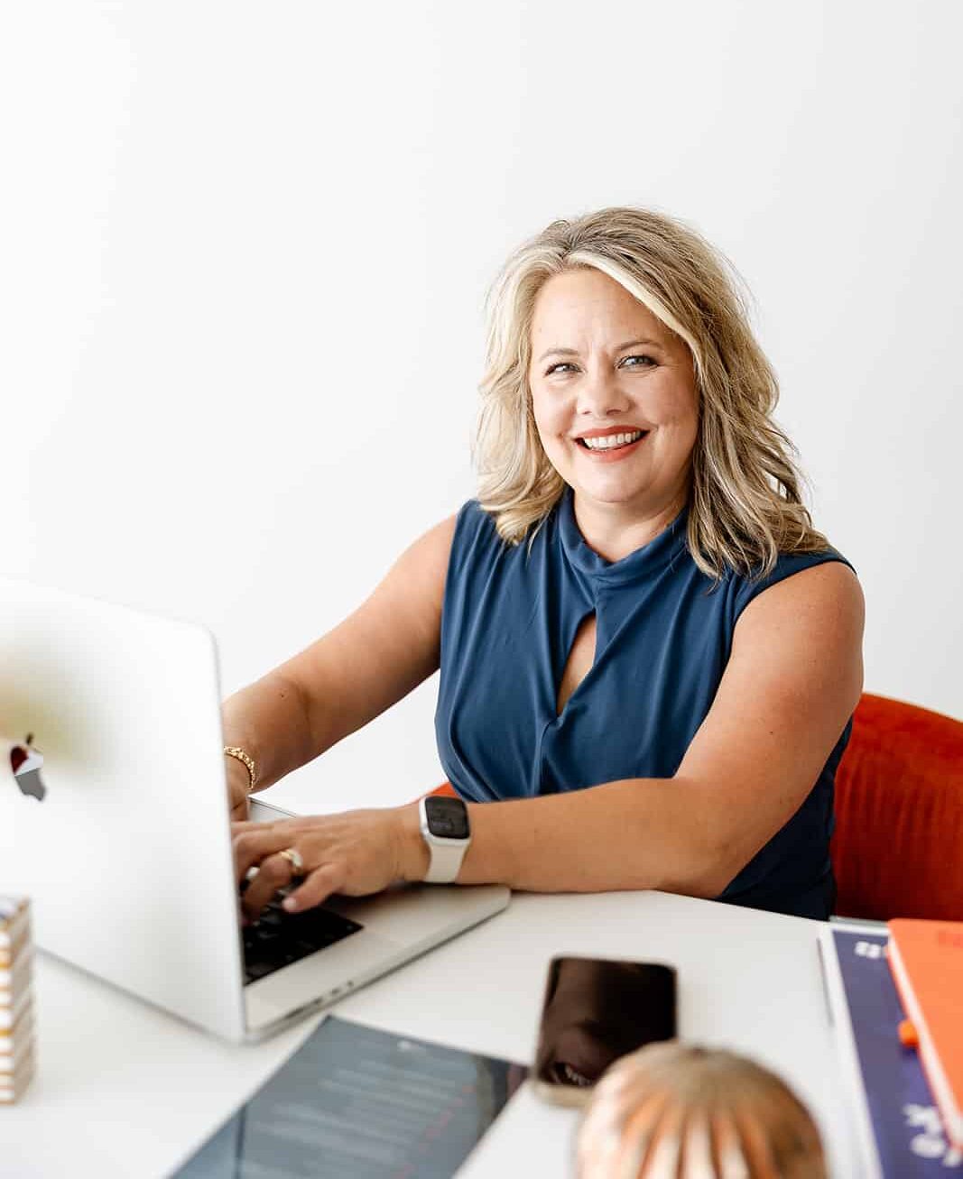 The conversation that matter CEO sitting at desk on laptop