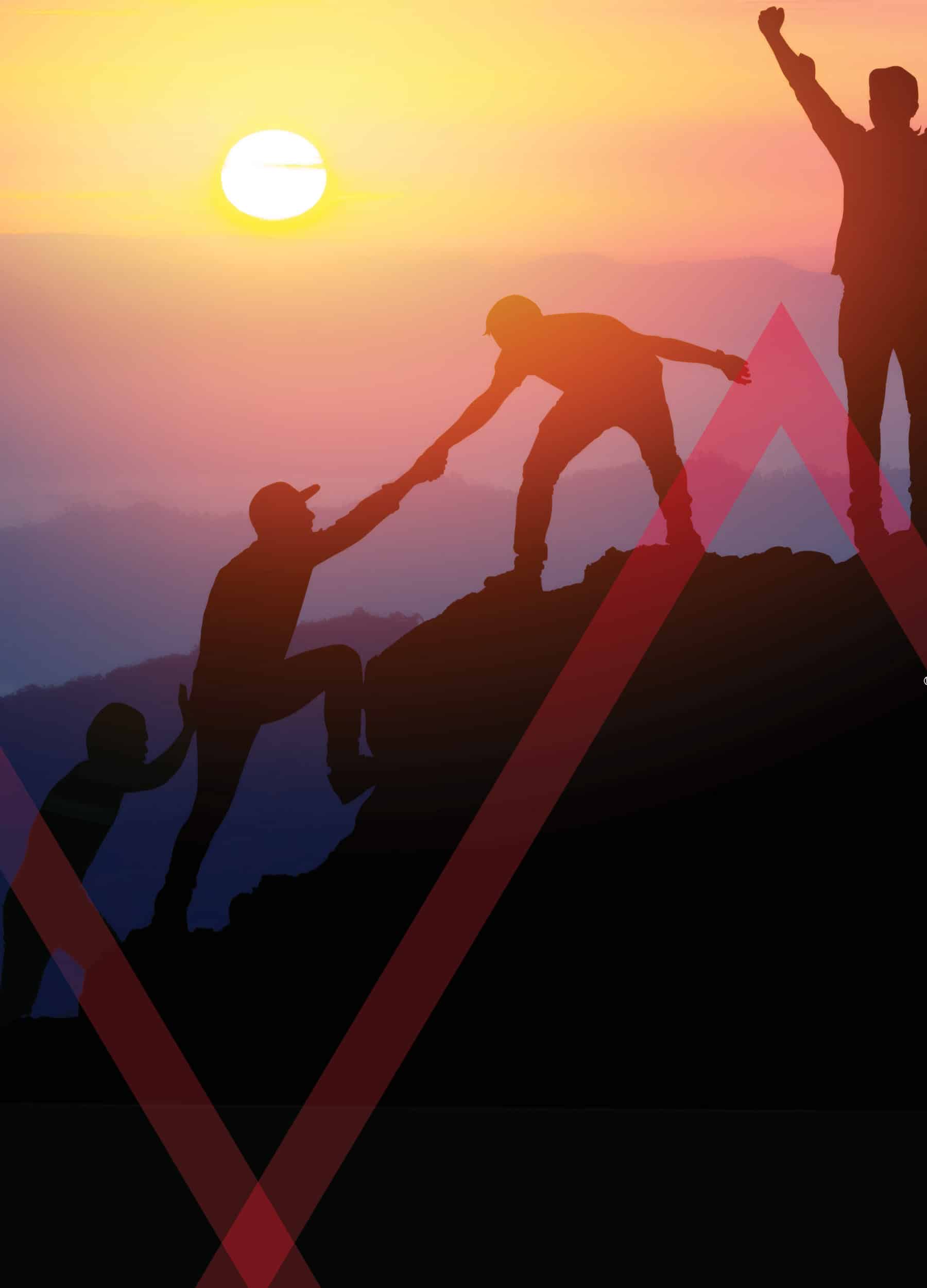 Team climbing a mountain together